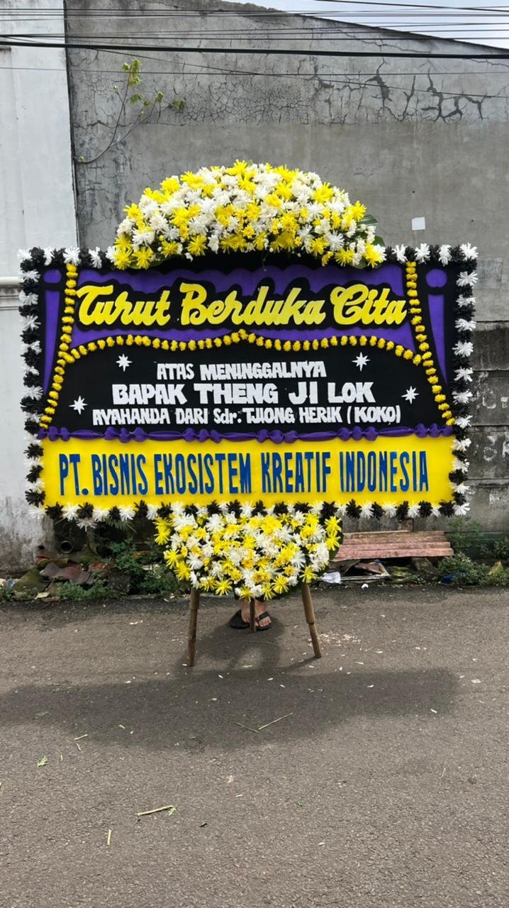Bunga papan duka cita ungu kuning untuk area Warung Bambu Karawang